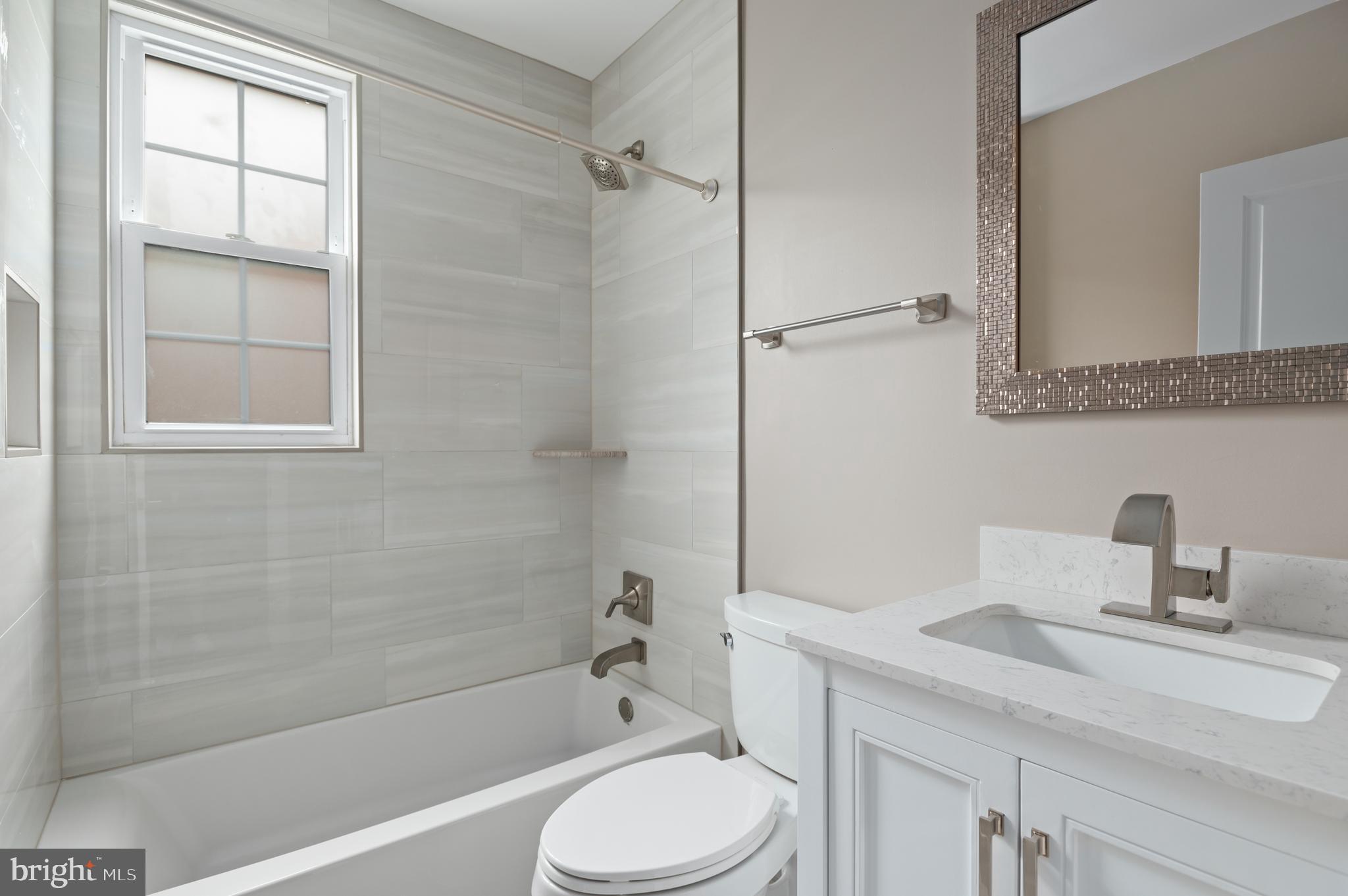 2215 40th Street Northwest, Unit 1 Washington, DC 20007 - Photo 14 of 21 a bathroom with a sink toilet and shower