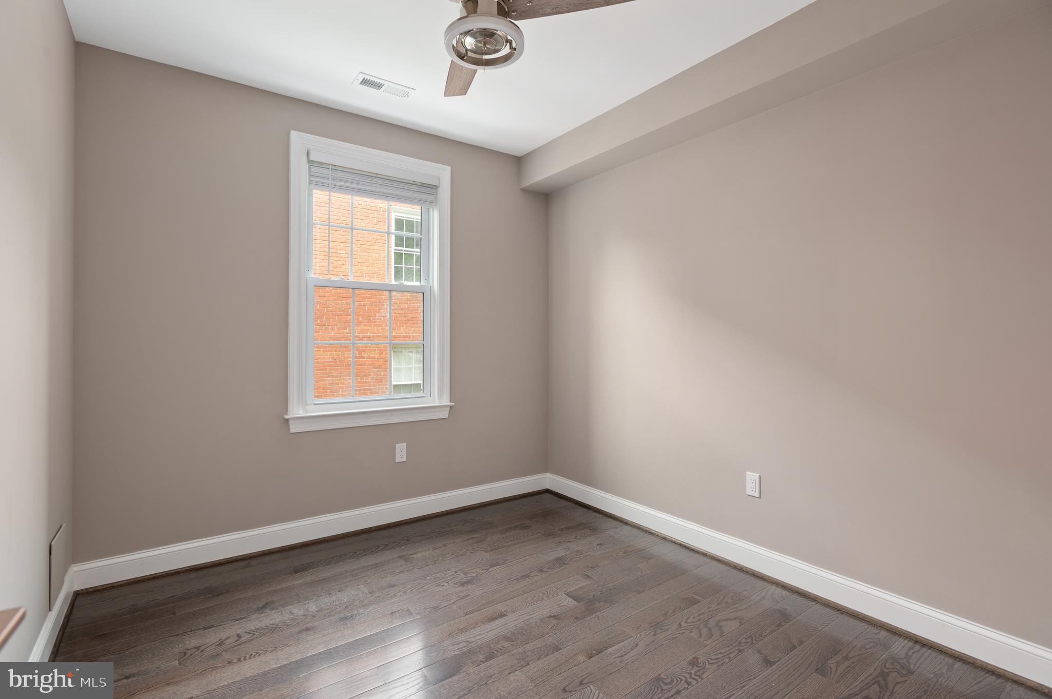 2215 40th Street Northwest, Unit 1 Washington, DC 20007 - Photo 15 of 21 an empty room with a window