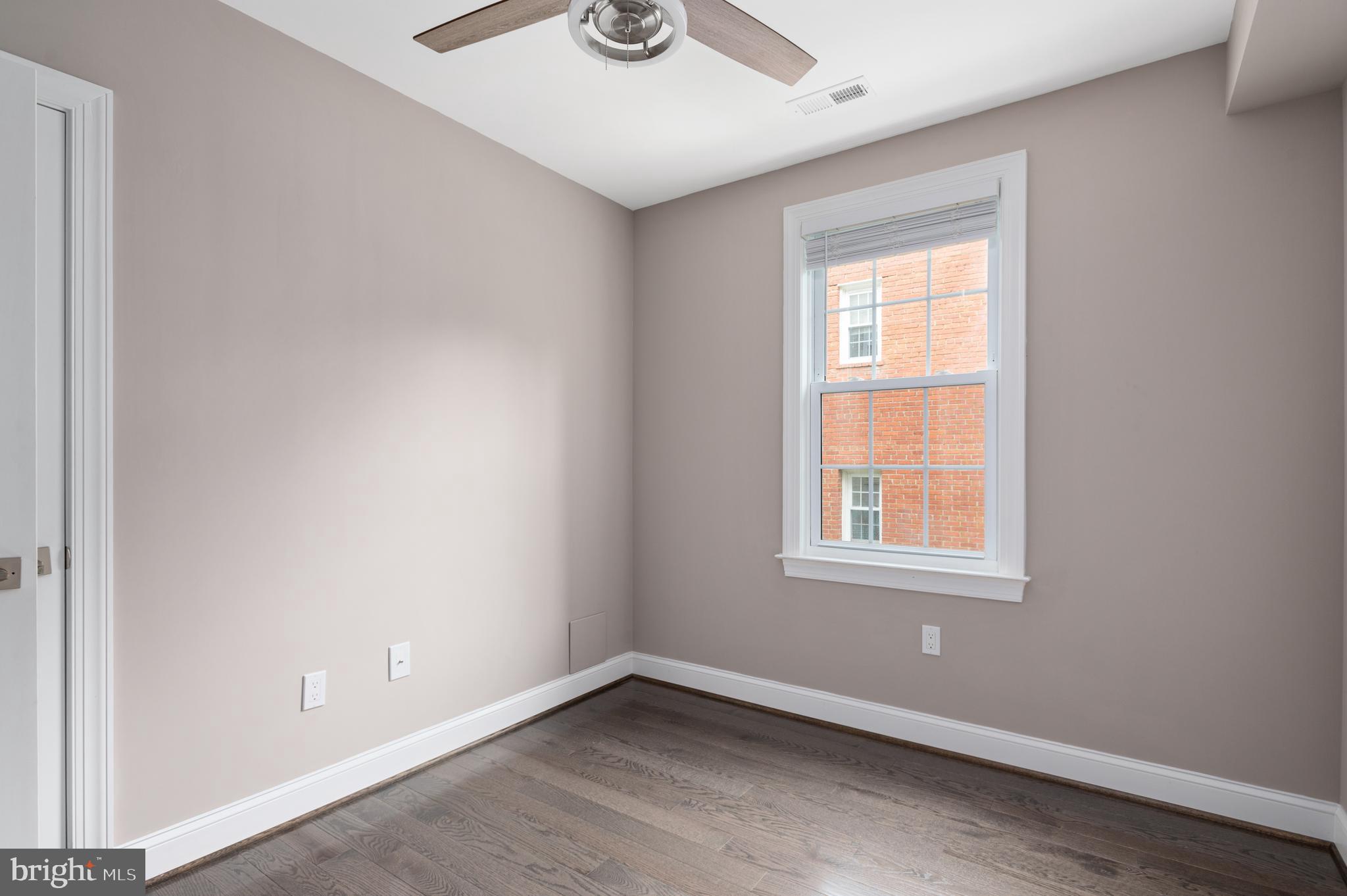 2215 40th Street Northwest, Unit 1 Washington, DC 20007 - Photo 16 of 21 an empty room with windows