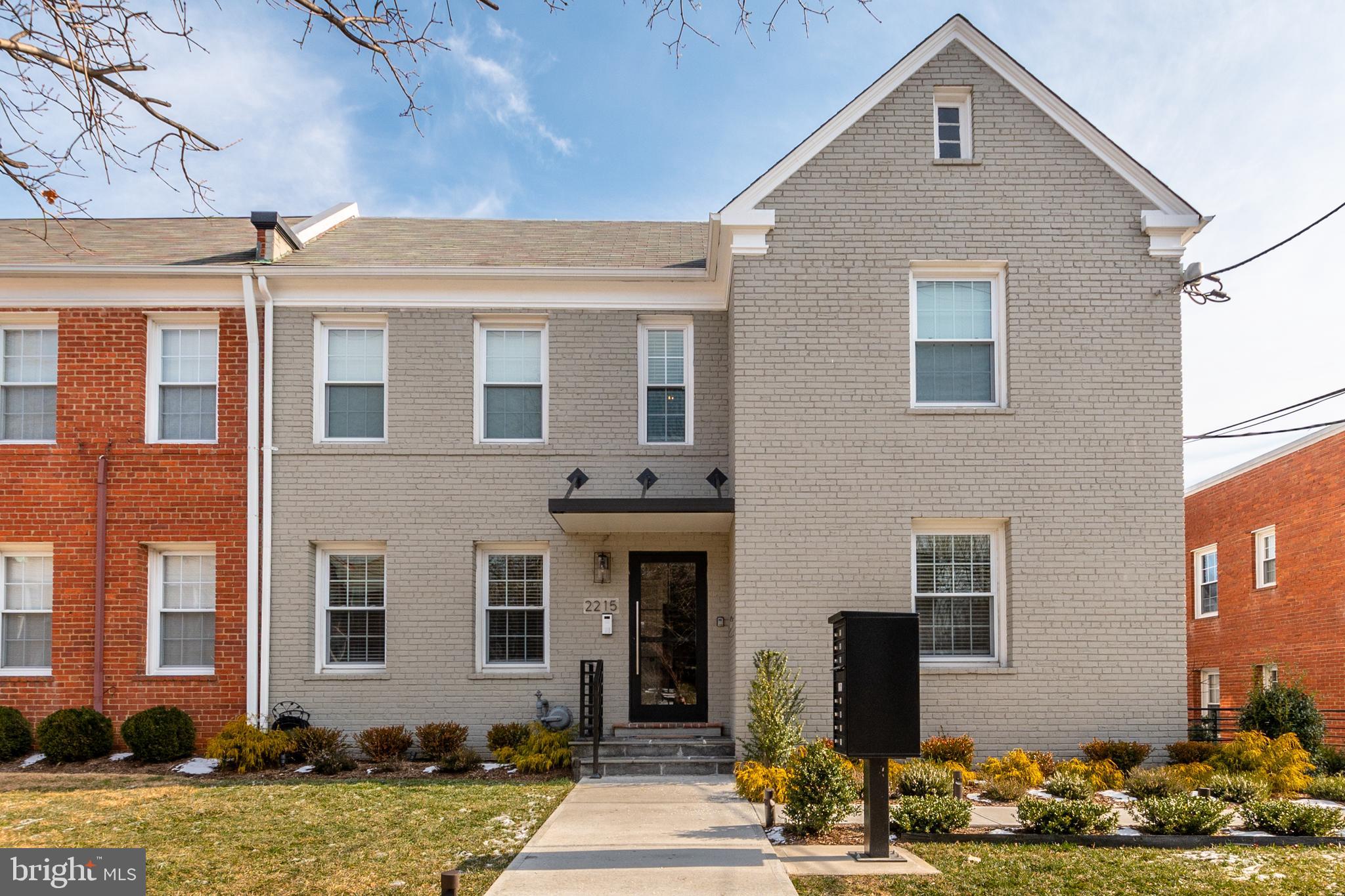 2215 40th Street Northwest, Unit 1 Washington, DC 20007 - Photo 2 of 21 a front view of a house with garden