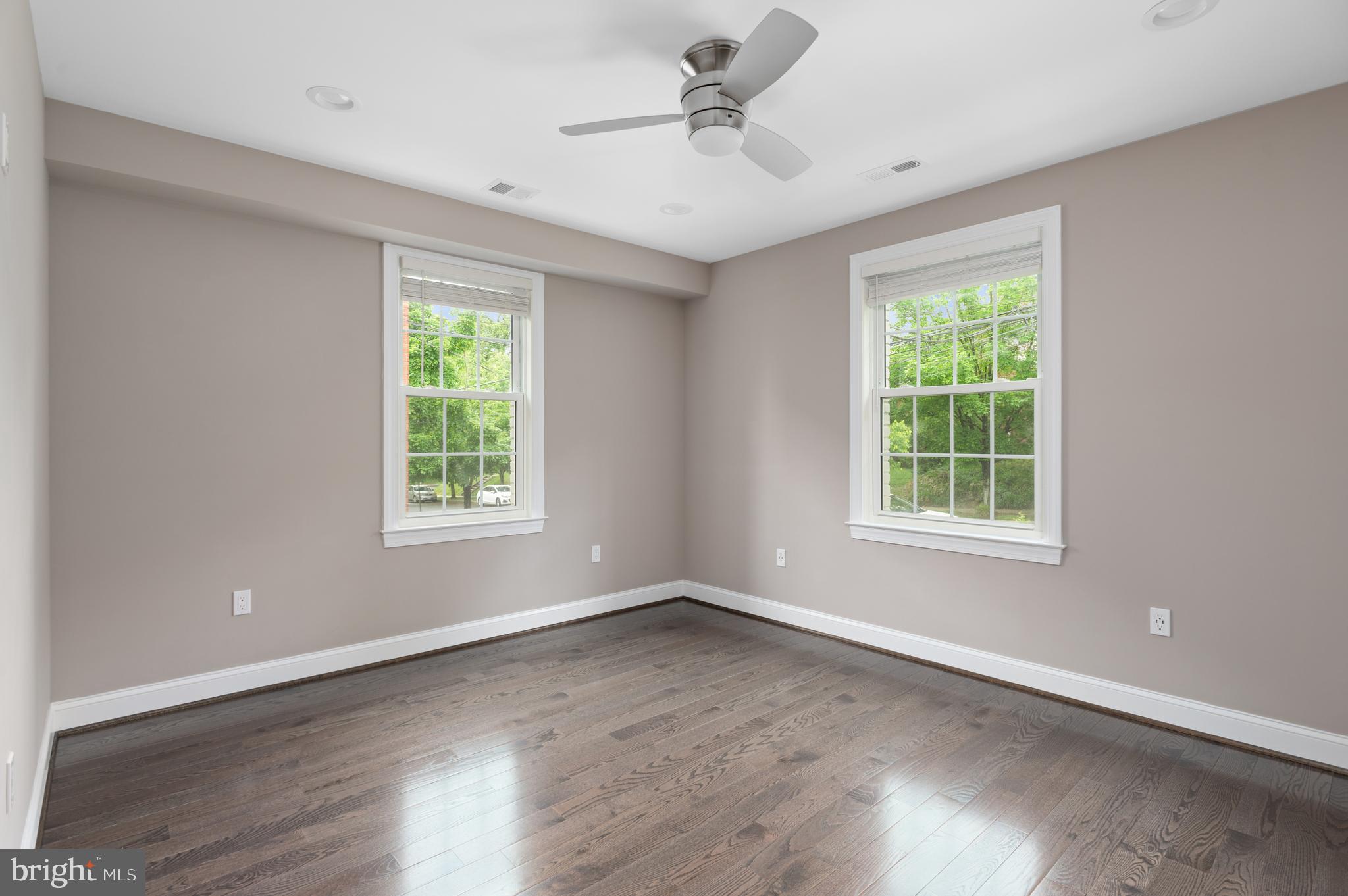 2215 40th Street Northwest, Unit 1 Washington, DC 20007 - Photo 5 of 21 a view of wooden floor and windows in a room