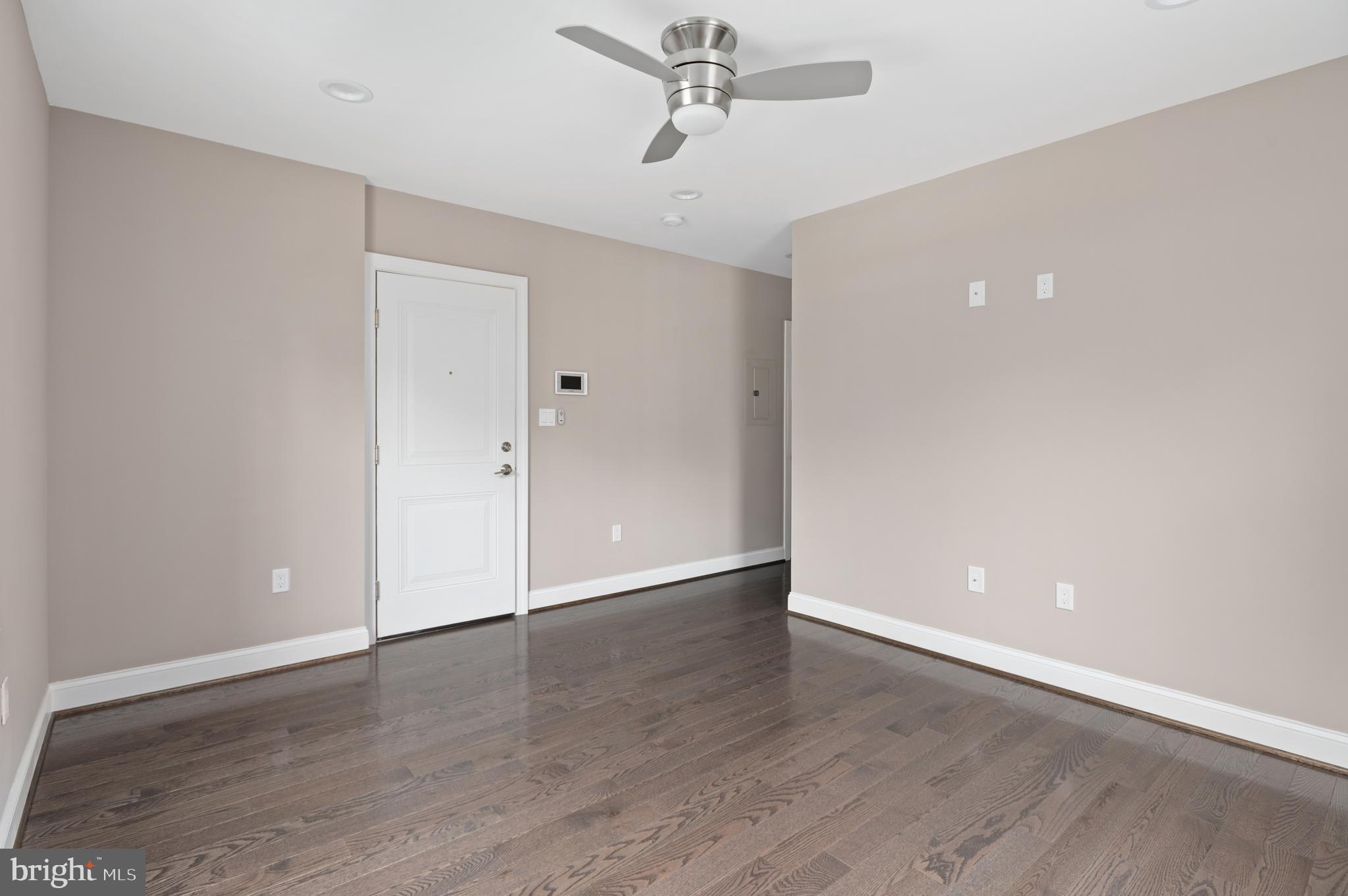 2215 40th Street Northwest, Unit 1 Washington, DC 20007 - Photo 7 of 21 a view of an empty room with wooden floor