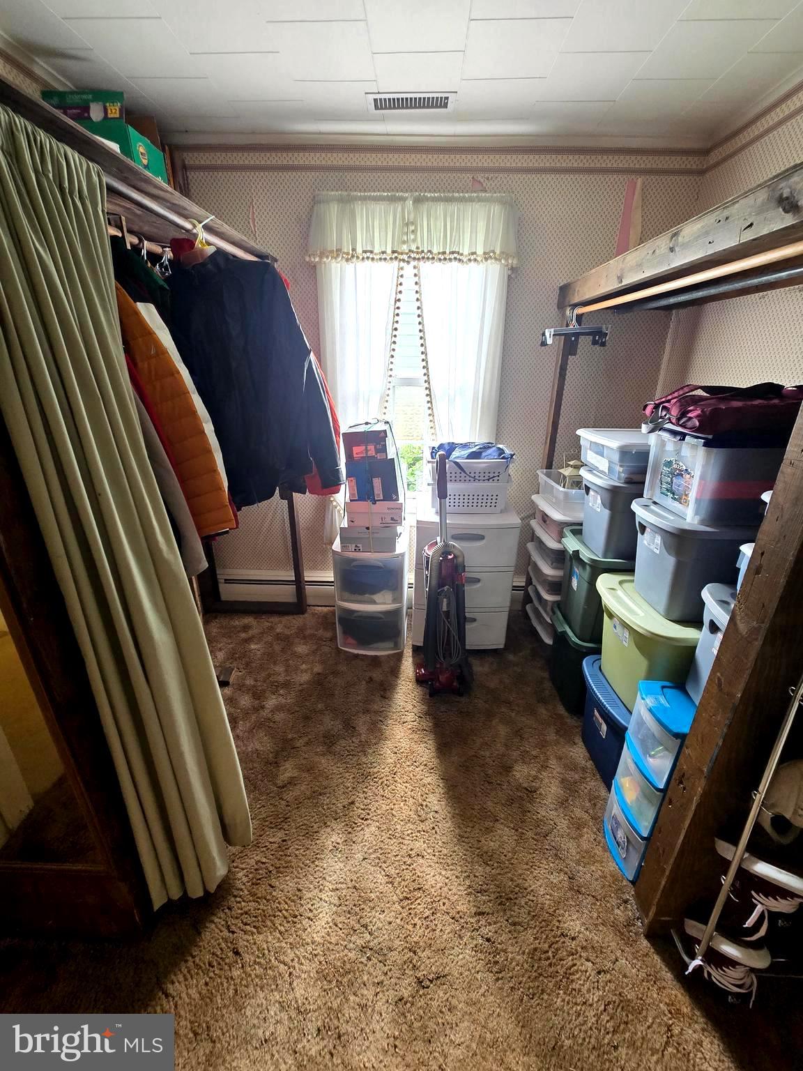 26431 Old State Road Crisfield, MD 21817 - Photo 14 of 25 a living room with furniture and a rug