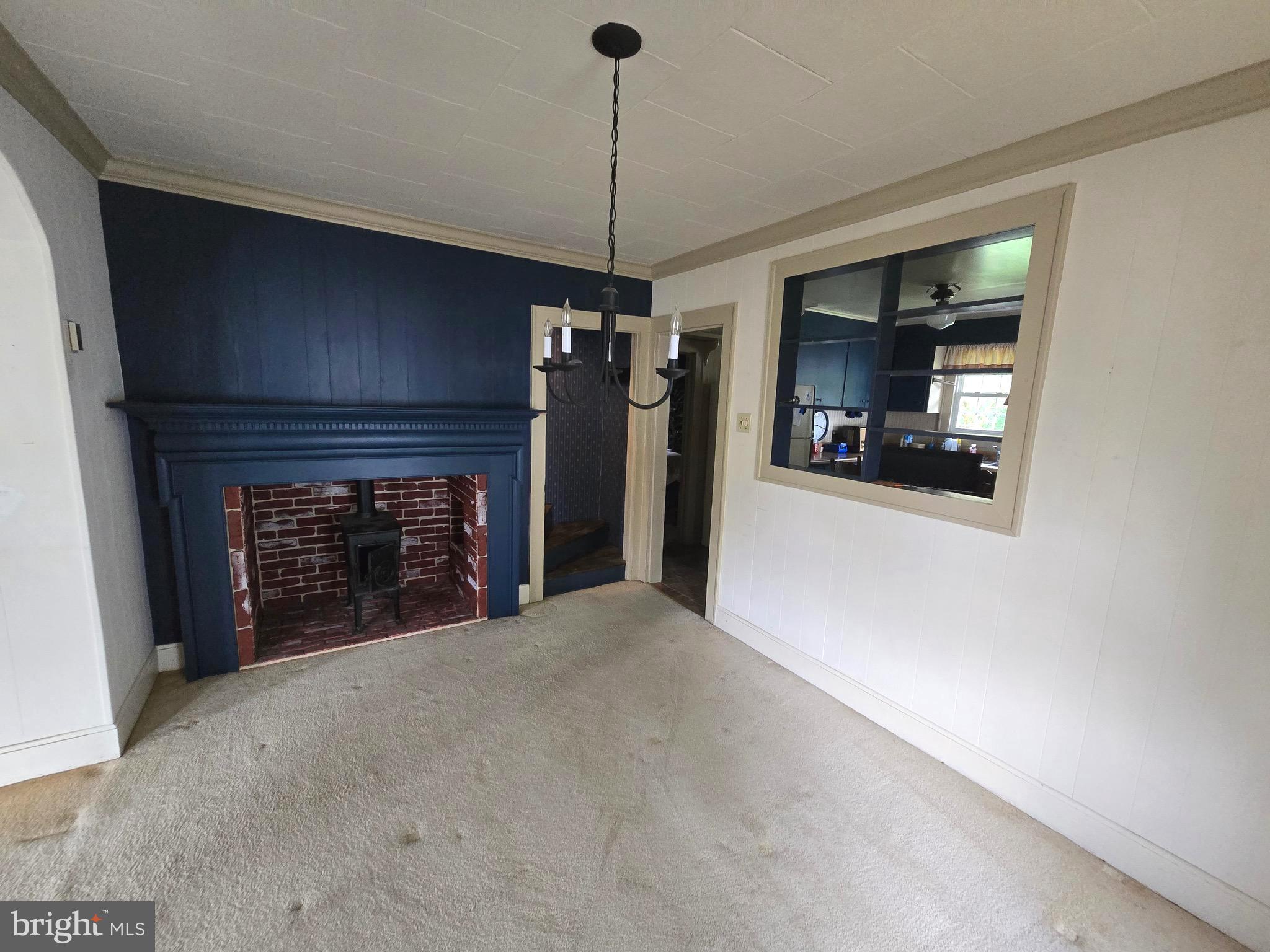 26431 Old State Road Crisfield, MD 21817 - Photo 17 of 25 a view of a livingroom with a fireplace