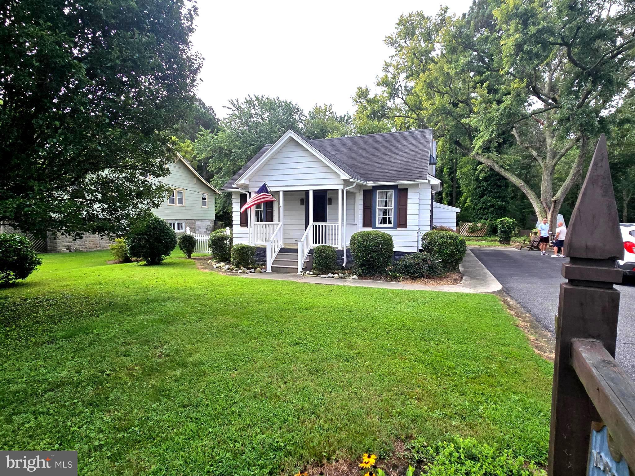 26431 Old State Road Crisfield, MD 21817 - Photo 2 of 25 a front view of house with yard and green space
