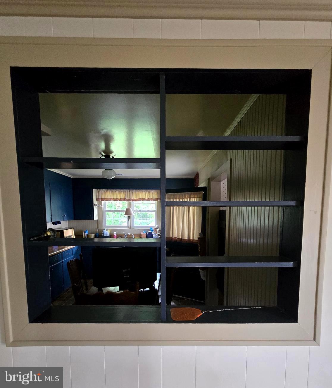 26431 Old State Road Crisfield, MD 21817 - Photo 21 of 25 a kitchen with a stove and a microwave