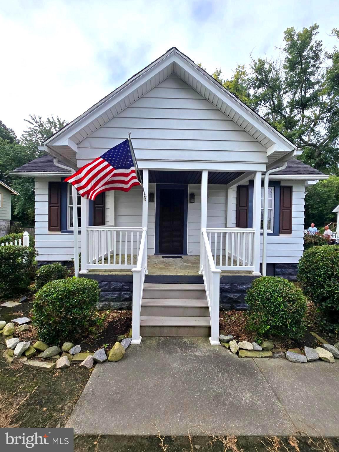 26431 Old State Road Crisfield, MD 21817 - Photo 3 of 25 a front view of a house with entryway and stairs