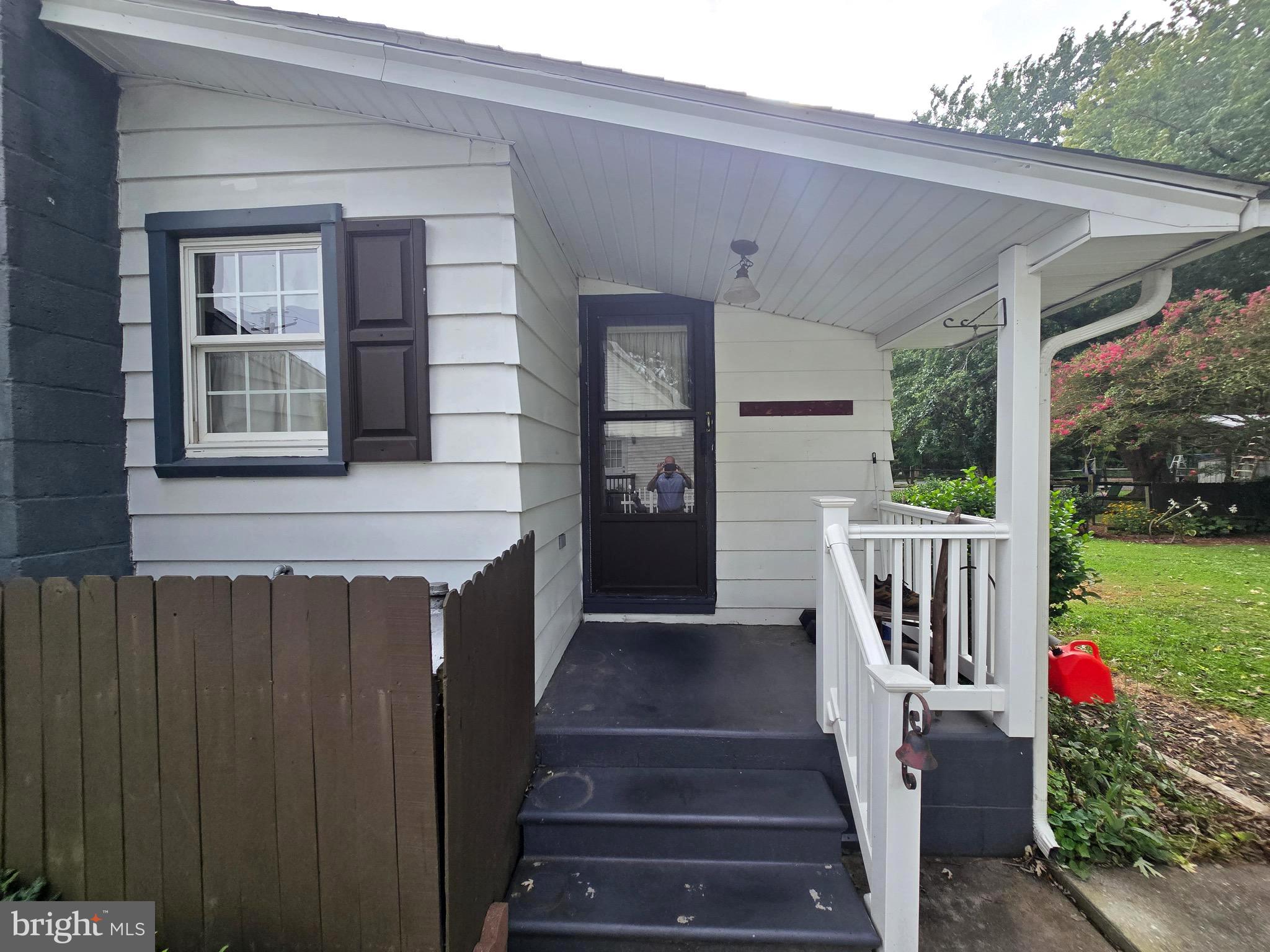 26431 Old State Road Crisfield, MD 21817 - Photo 6 of 25 a view of a house with backyard and wooden fence