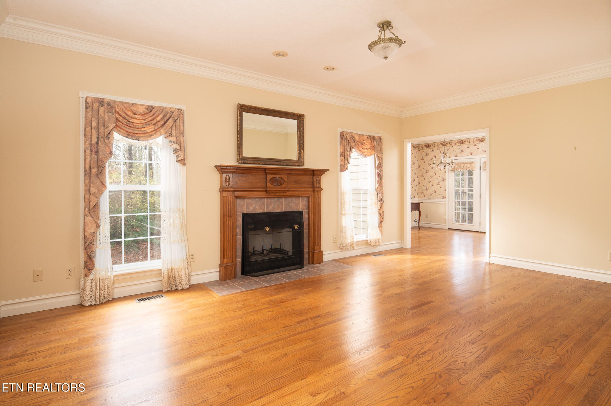 6215 Cardwell Road Corryton, TN 37721 - Photo 9 of 22 a view of an empty room with a window and fireplace