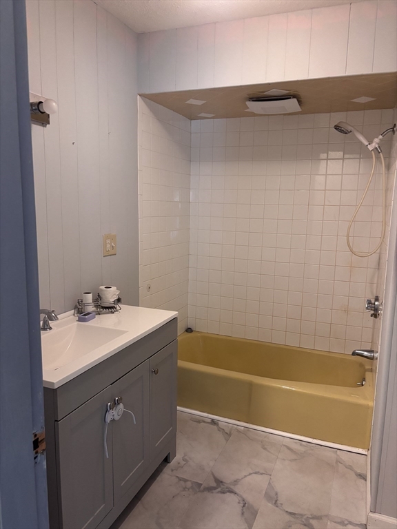 349 Oak Street Clinton, MA 01510 - Photo 6 of 9 a bathroom with a sink and a bathtub