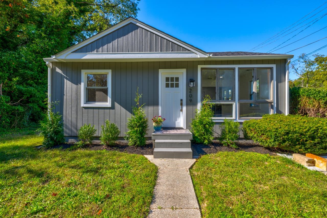 209 Breakwater Road Cape May, NJ 08204 - Photo 1 of 20 a front view of a house with a yard