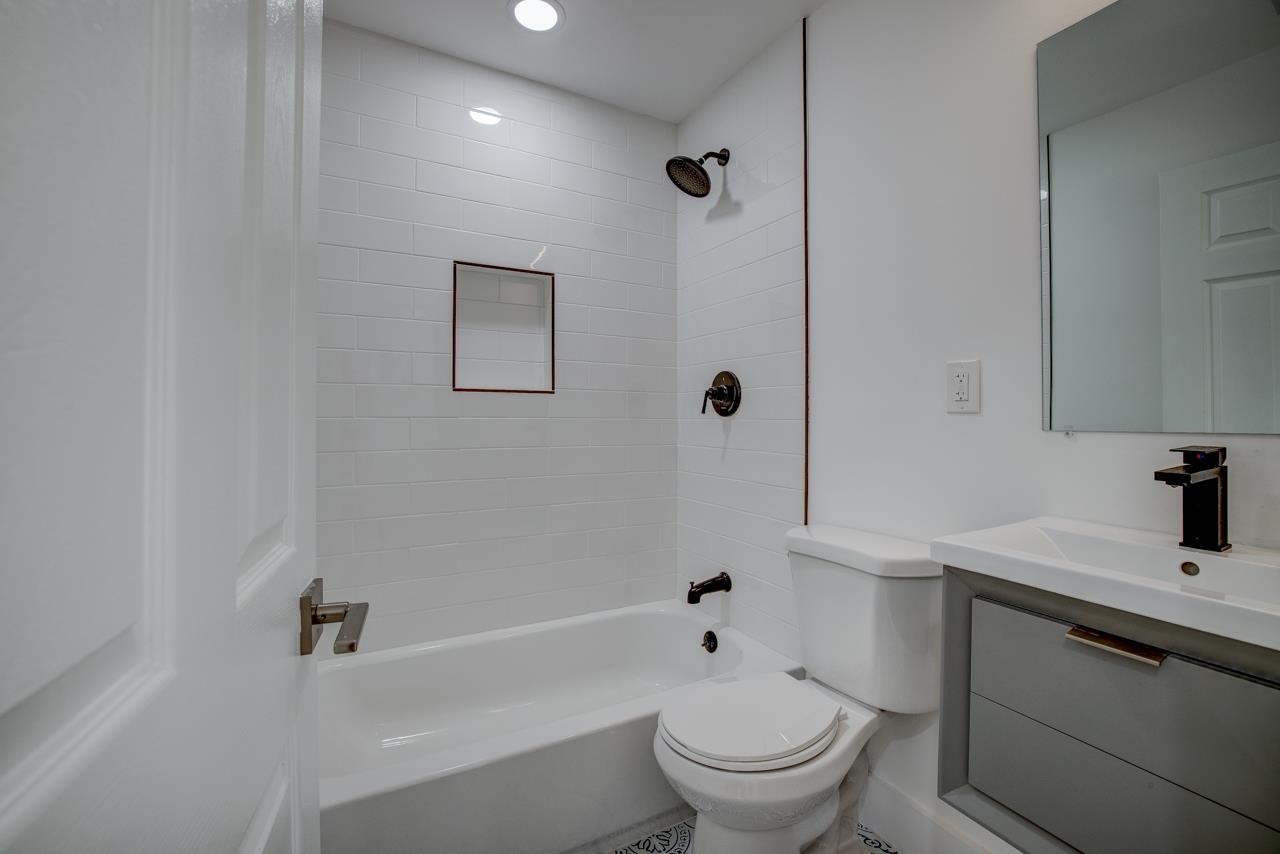 209 Breakwater Road Cape May, NJ 08204 - Photo 7 of 20 a bathroom with a sink toilet and shower