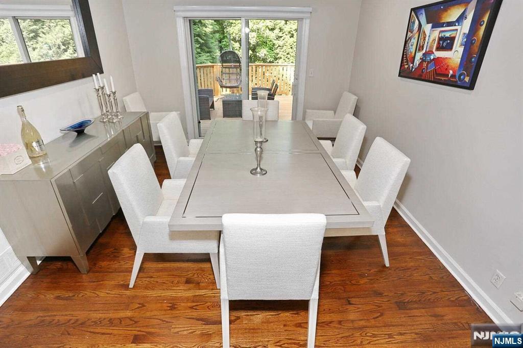 11 Evans Road Cresskill, NJ 07626 - Photo 14 of 31 a view of a dining room with furniture a rug and wooden floor