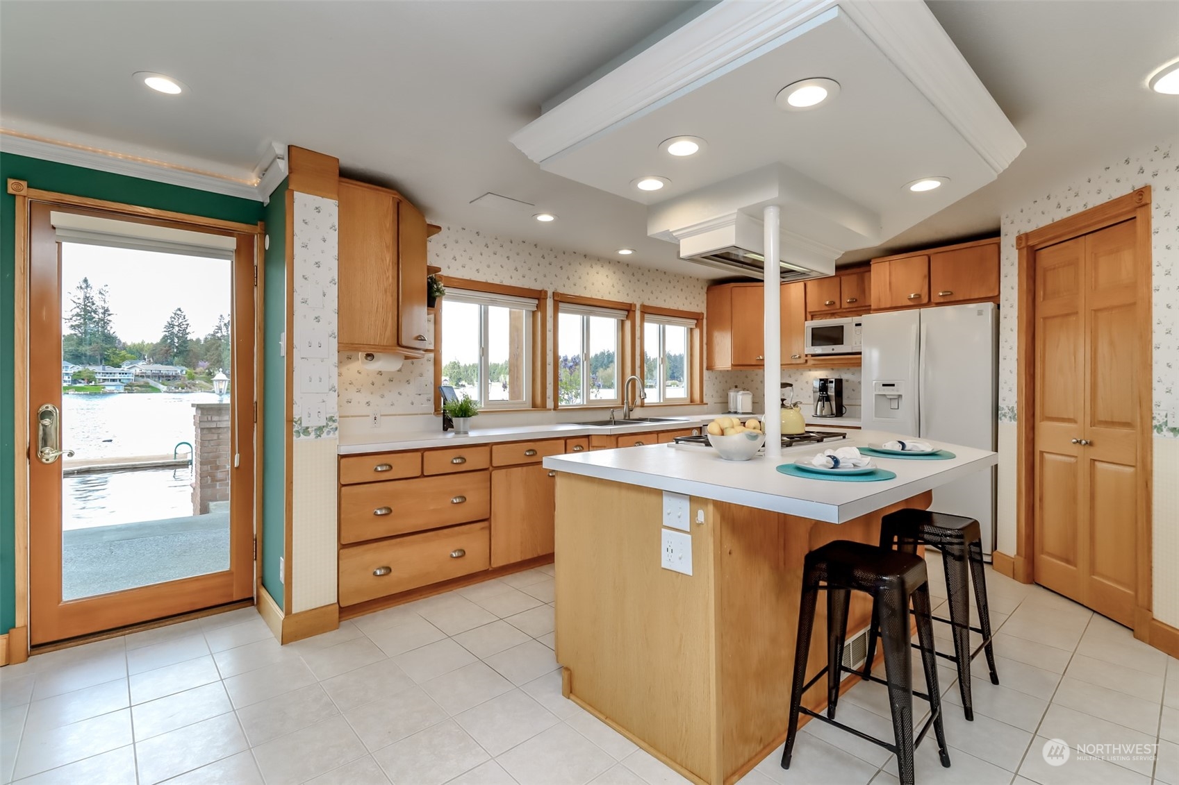 2513 Mayes Road Southeast Olympia, WA 98503 - Photo 11 of 30 a kitchen with kitchen island a large counter top space appliances and a window