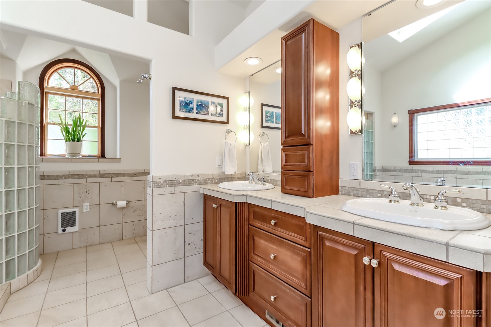 2513 Mayes Road Southeast Olympia, WA 98503 - Photo 18 of 30 a spacious bathroom with a double vanity sink a mirror and a bathtub