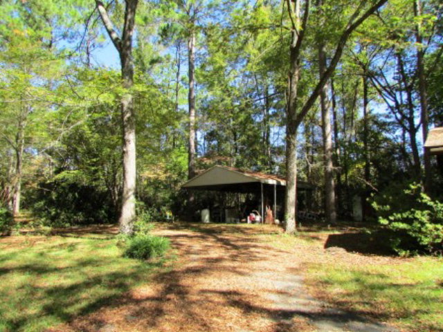 400 Homer Roberts Road Gray, GA 31032 - Photo 22 of 23 a front view of a house with a yard