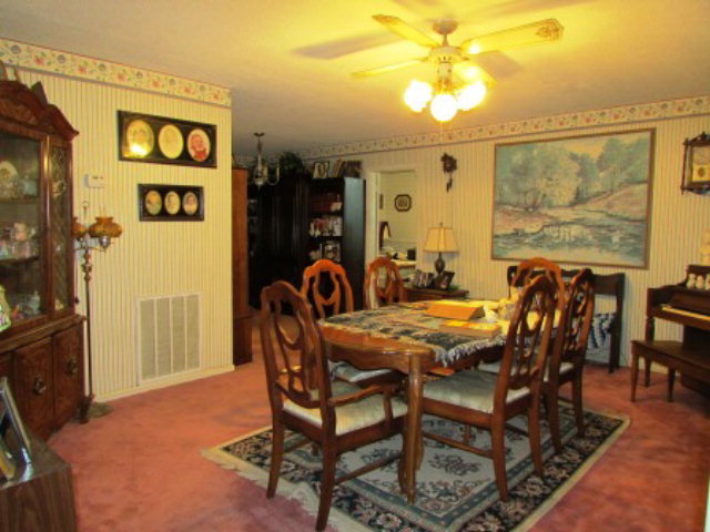 400 Homer Roberts Road Gray, GA 31032 - Photo 4 of 23 a view of a dining room and livingroom with furniture window and wooden floor