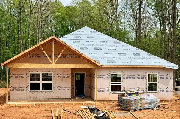 a front view of a house with yard