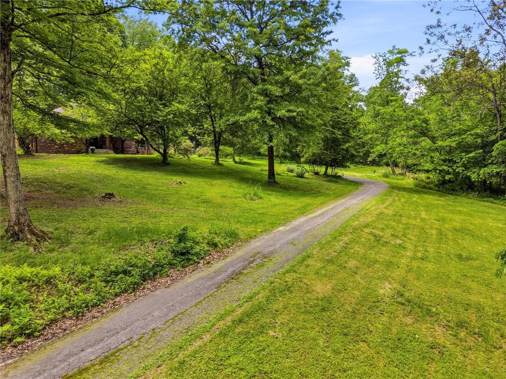 21 West Hillcrest Road Eighty Four, PA 15330 - Photo 2 of 45 a view of a backyard with large trees