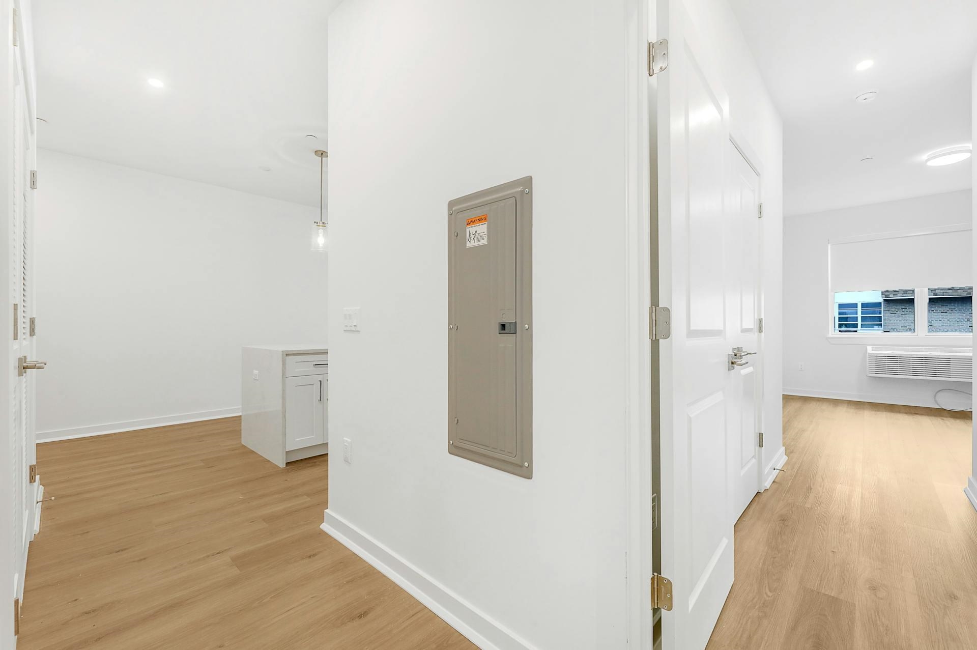 74 Clarendon Place, Unit 202 Hackensack, NJ 07601 - Photo 12 of 33 a view of a room with wooden floor and a bathroom