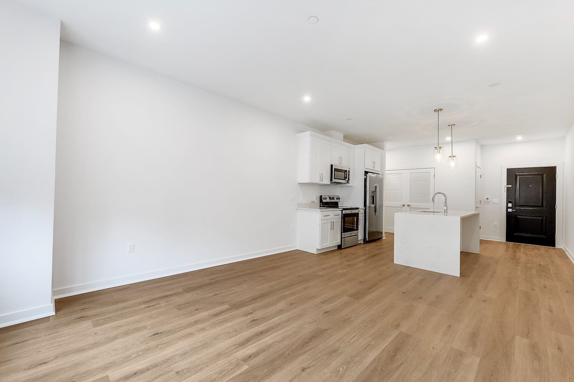 74 Clarendon Place, Unit 202 Hackensack, NJ 07601 - Photo 6 of 33 a view of a kitchen with refrigerator and wooden floor