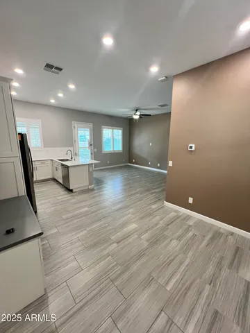 a view of a livingroom with furniture and a window