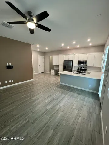 a view of kitchen with sink and microwave