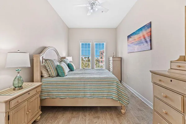 a bedroom with a bed and a dresser