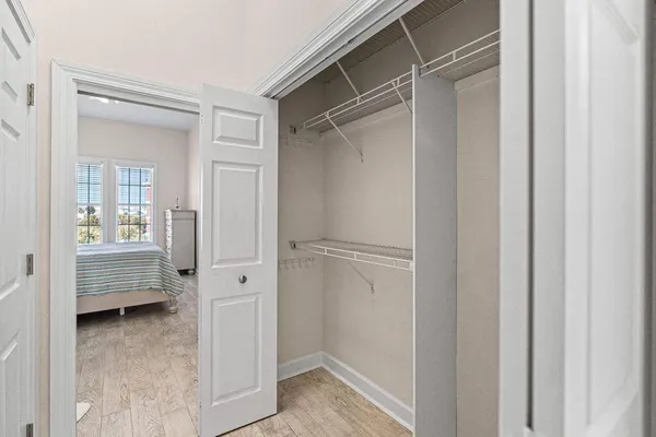 a bedroom with a bed and a lamp