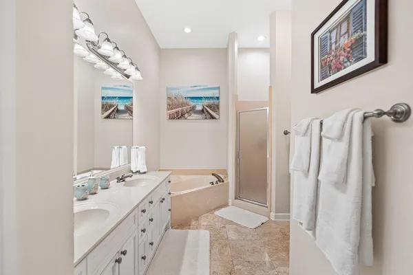 a bedroom with a bed and a mirror