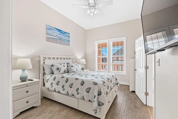 a bedroom with a large bed and a window