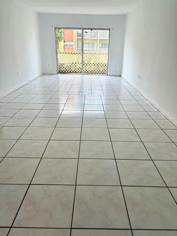 a view of empty room with windows