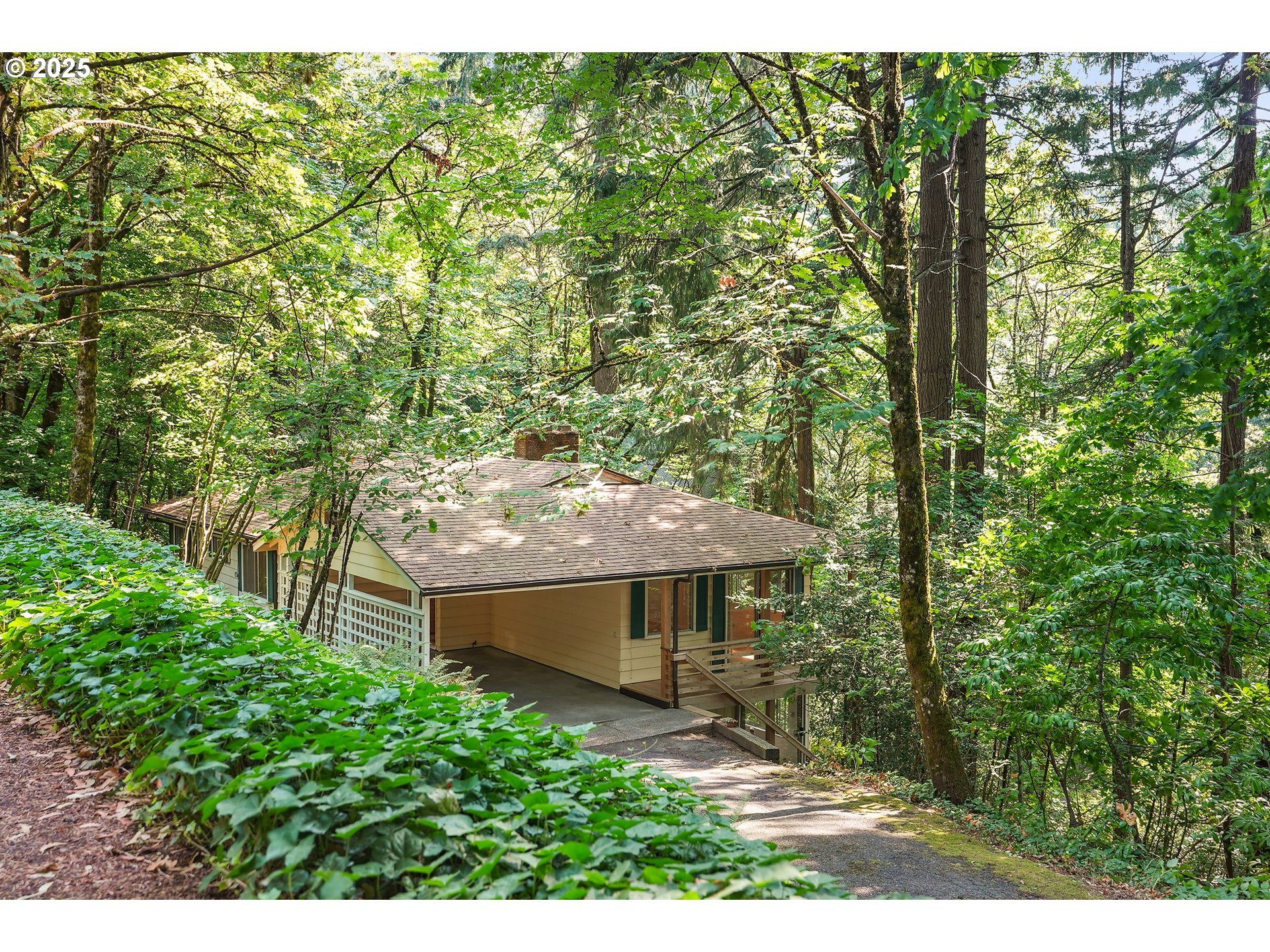 3270 Southwest Fairmount Boulevard Portland, OR 97239 - Photo 1 of 48 a backyard of a house with table and chairs