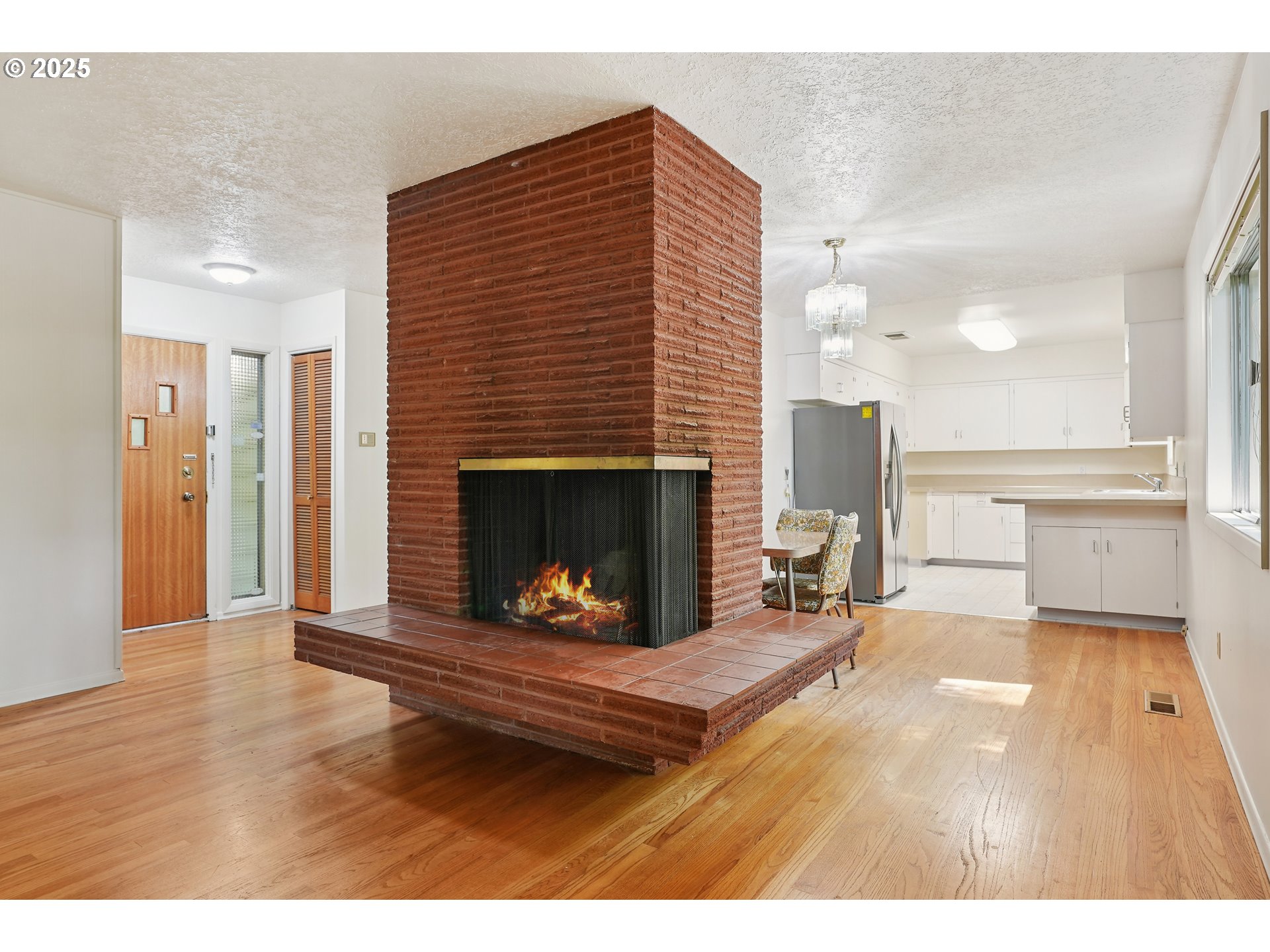 3270 Southwest Fairmount Boulevard Portland, OR 97239 - Photo 13 of 48 a living room with furniture and a fireplace