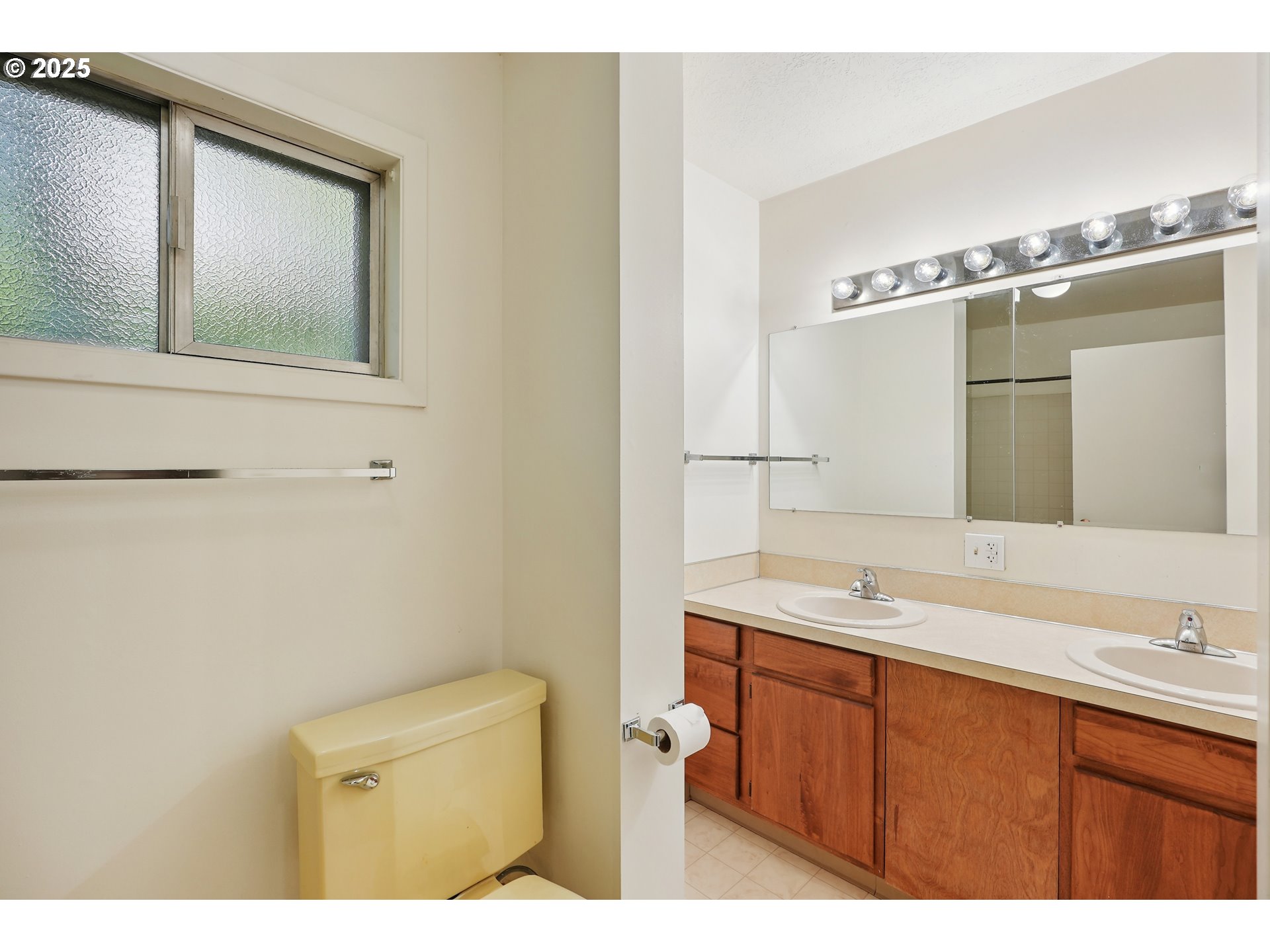 3270 Southwest Fairmount Boulevard Portland, OR 97239 - Photo 26 of 48 a bathroom with a sink and a mirror