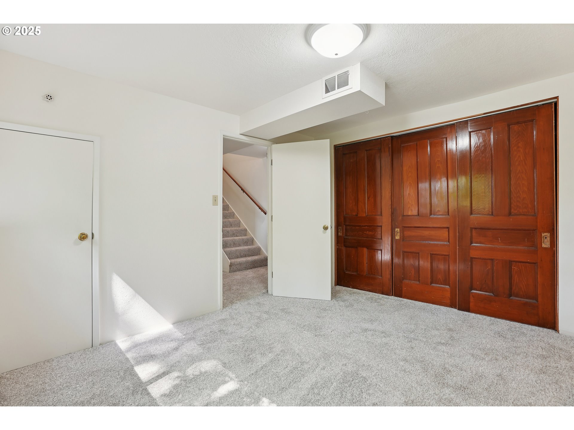 3270 Southwest Fairmount Boulevard Portland, OR 97239 - Photo 27 of 48 a view of an empty room with wooden floor