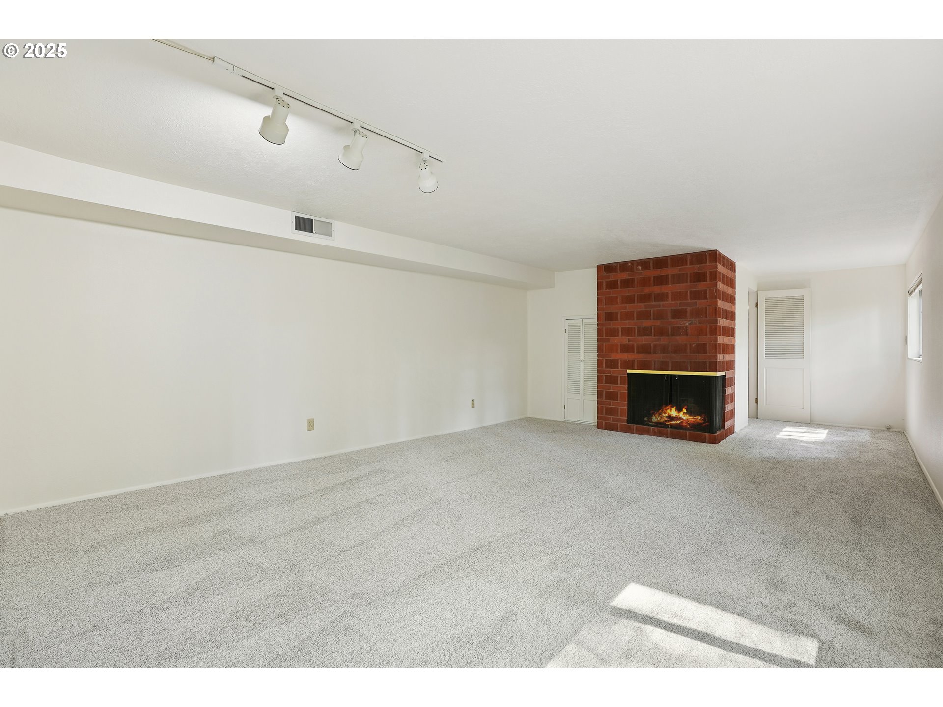 3270 Southwest Fairmount Boulevard Portland, OR 97239 - Photo 31 of 48 a view of empty room with a fireplace