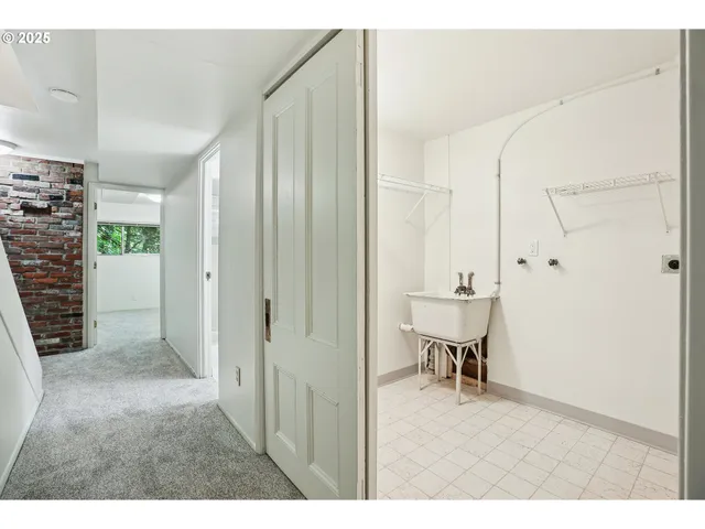 a view of a hallway with dining area and glass door