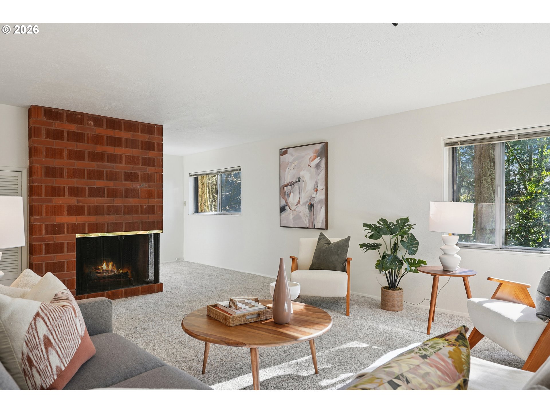3270 Southwest Fairmount Boulevard Portland, OR 97239 - Photo 47 of 48 a living room with furniture and a fireplace