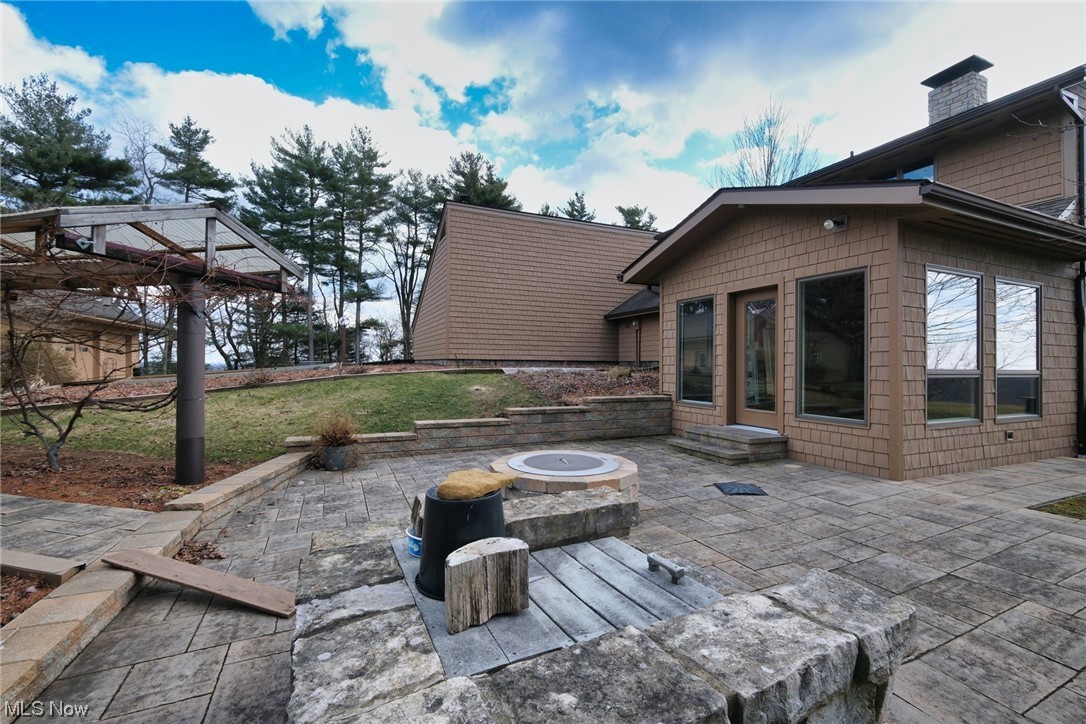 2753 Tabor Ridge Road Northeast Mineral City, OH 44656 - Photo 9 of 41 View of patio with a fire pit
