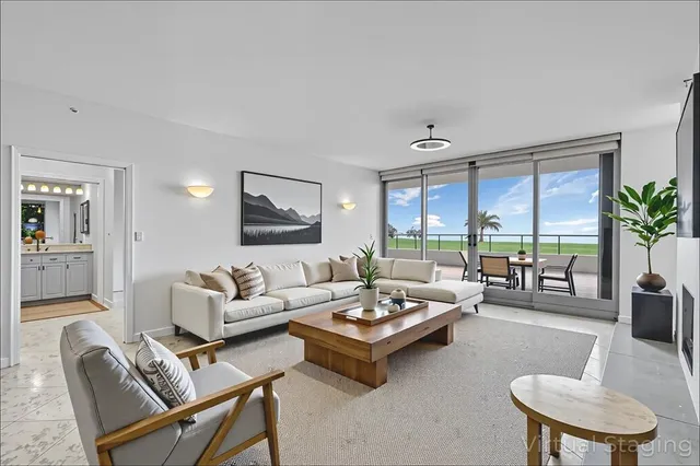 a dining room with wooden floor a sink and a window