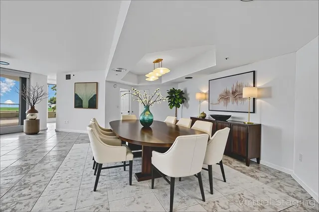 a bathroom with a granite countertop sink a toilet a mirror and bathtub