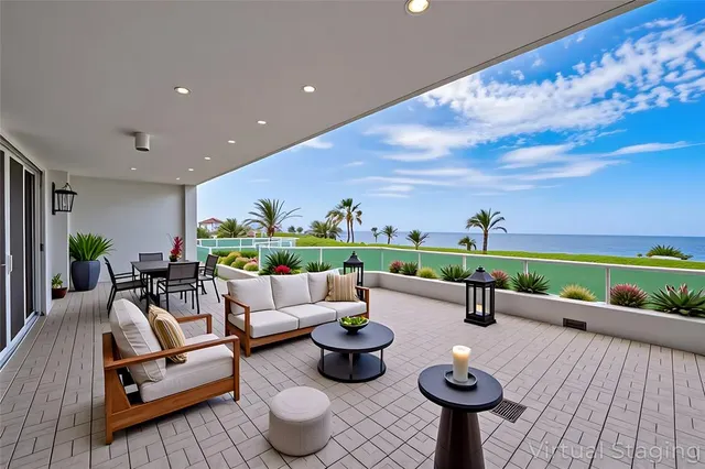 a living room with furniture and a garden