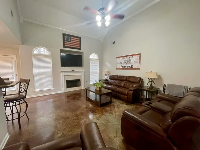 a large kitchen with a table and chairs