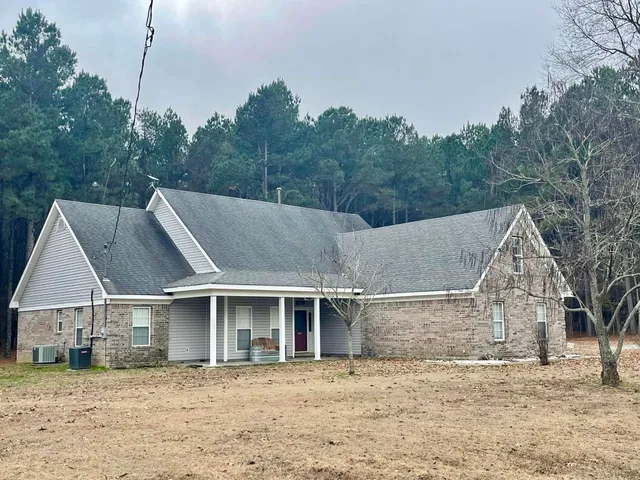 a view of a house with a garden