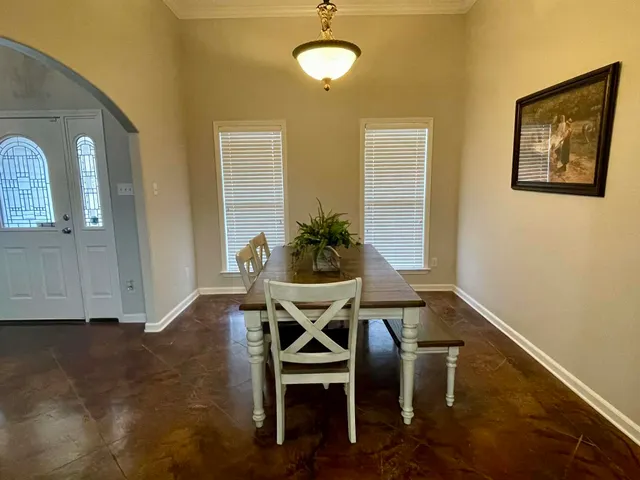 a view of room with window and furniture
