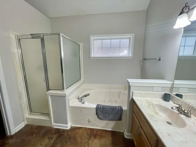 a bathroom with a sink double vanity granite and a mirror