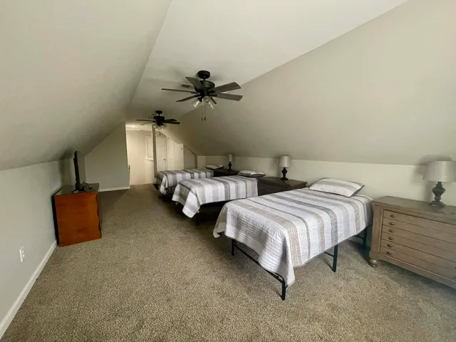 a bedroom with furniture and natural light