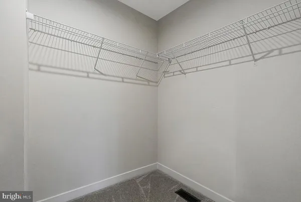 a view of a room with racks on the wall