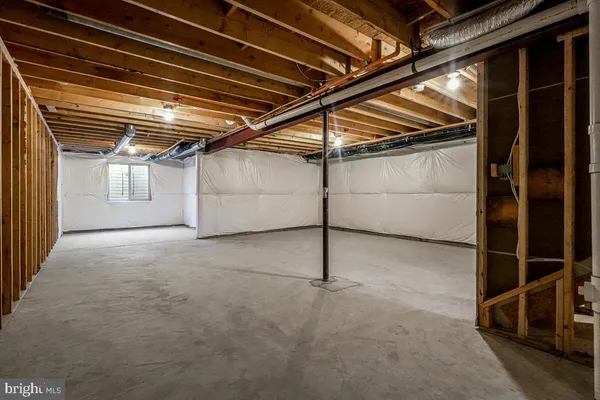 a view of an empty room with wooden walls
